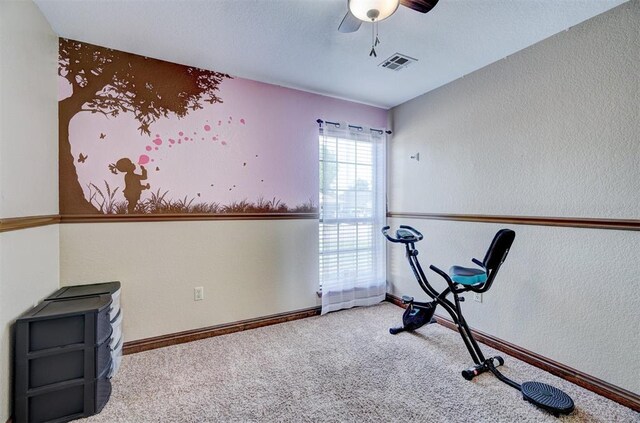 7904 NW 81st St, Oklahoma City, OK 73132 - workout room with baseboards, visible vents, ceiling fan, and carpet flooring
