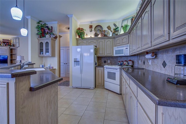 kitchen featuring crown molding, dark countertops, a sink, white appliances, and tasteful backsplash