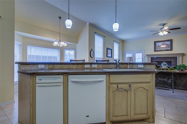 kitchen featuring a sink, light tile patterned floors, open floor plan, and dishwasher