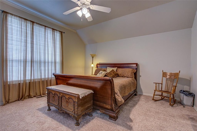 bedroom featuring baseboards, carpet flooring, a ceiling fan, and vaulted ceiling