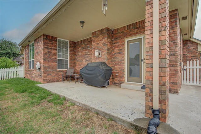 view of patio / terrace featuring area for grilling and fence