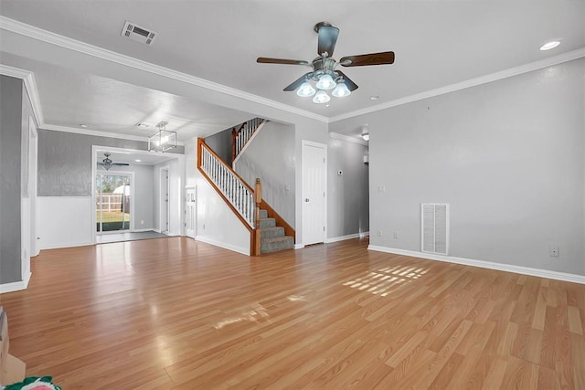 unfurnished living room featuring light wood-type flooring, ceiling fan, stairway, and visible vents