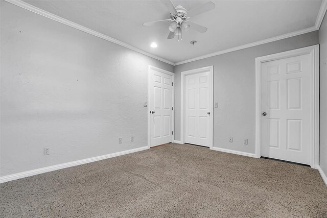 unfurnished bedroom with carpet floors, ceiling fan, crown molding, and baseboards