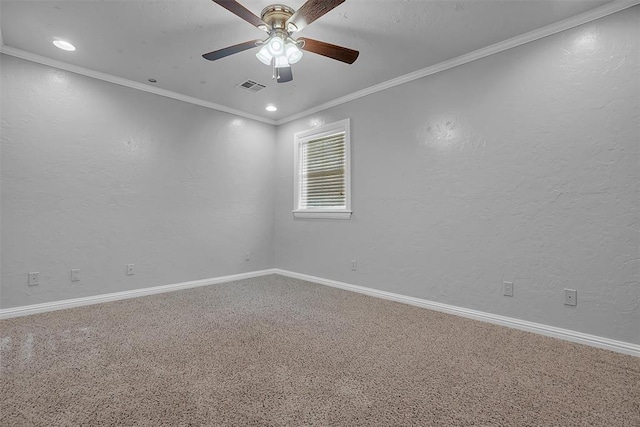 unfurnished room featuring crown molding, visible vents, baseboards, carpet, and a ceiling fan