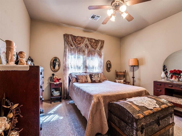 bedroom featuring visible vents, a ceiling fan, and carpet flooring