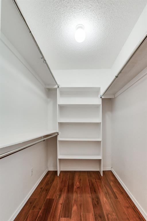 spacious closet with wood finished floors