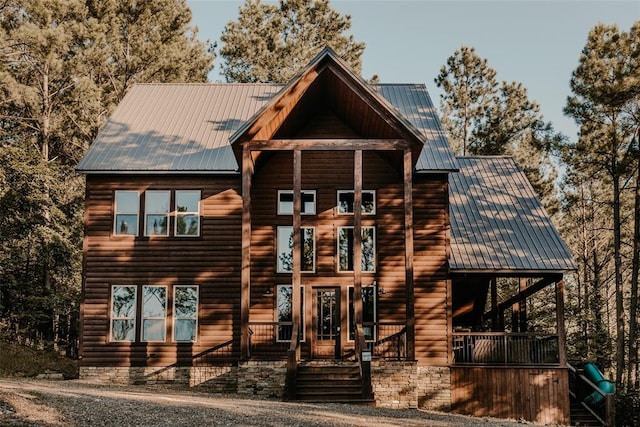 rustic home featuring metal roof