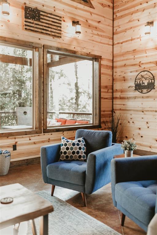 sitting room with wood walls