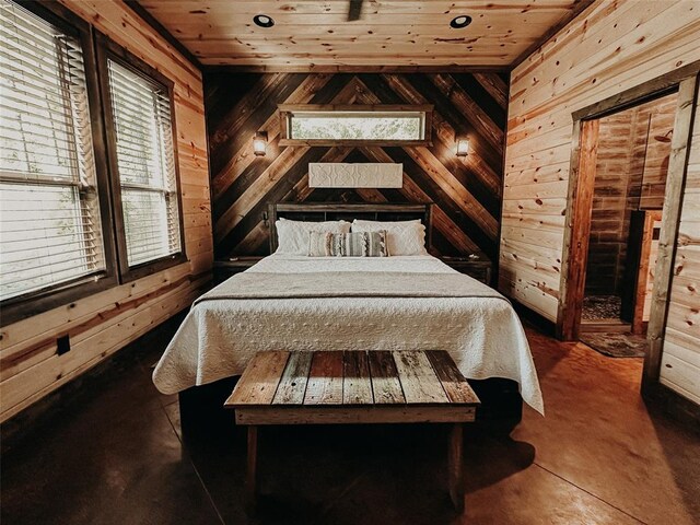 bedroom with wooden walls and wooden ceiling