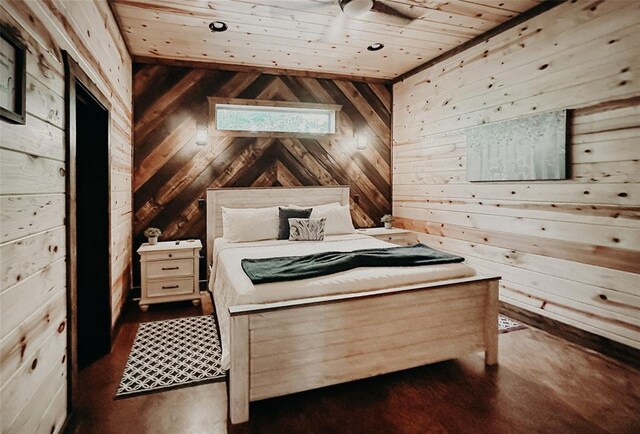 bedroom with wood walls and wood ceiling