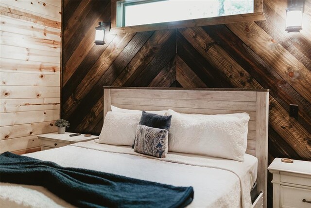 bedroom with wooden walls