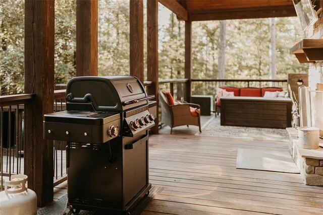 deck featuring an outdoor hangout area and a grill
