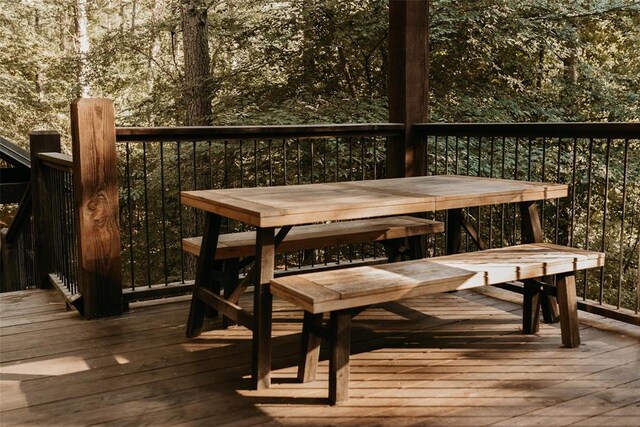 interior space with outdoor dining area and a deck