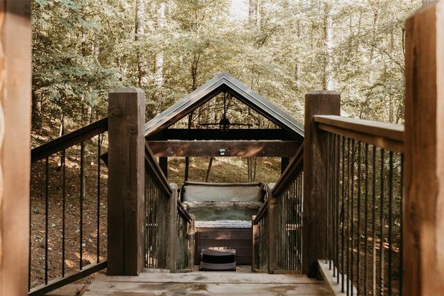 deck featuring a hot tub