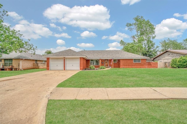 305 S Mockingbird Dr, Altus, OK 73521 - ranch-style house with concrete driveway, brick siding, a front lawn, and a garage