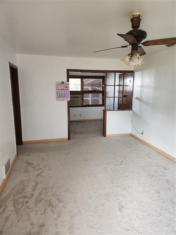 1405 N York St, Altus, OK 73521 - empty room with carpet flooring, ceiling fan, and baseboards