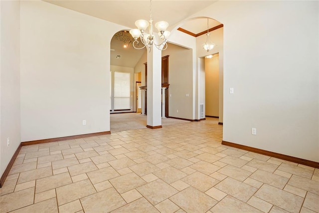 unfurnished room featuring baseboards, lofted ceiling, arched walkways, and a notable chandelier