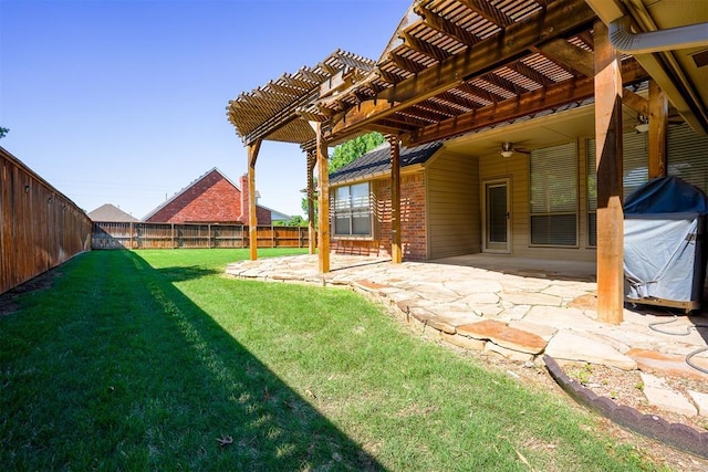 view of yard featuring ceiling fan, a patio area, a pergola, and a fenced backyard