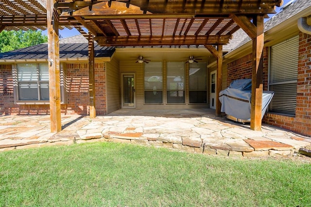 view of patio / terrace with a ceiling fan and a pergola