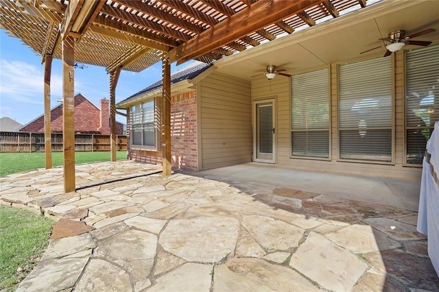 view of patio / terrace with a pergola, fence, and a ceiling fan