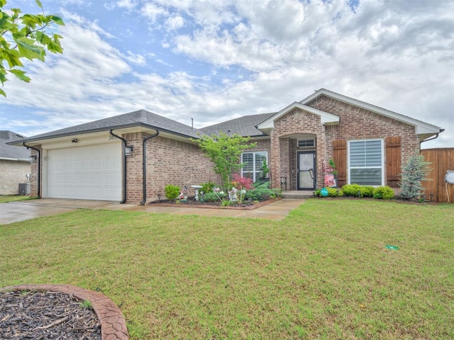 single story home featuring brick siding, a garage, roof with shingles, a front lawn, and concrete driveway