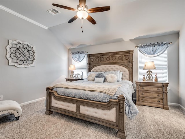bedroom with lofted ceiling, visible vents, baseboards, and light carpet