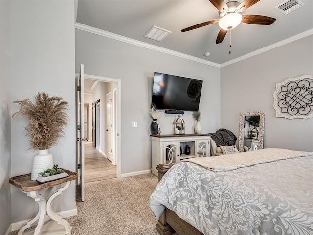 bedroom featuring visible vents, baseboards, ornamental molding, and light carpet