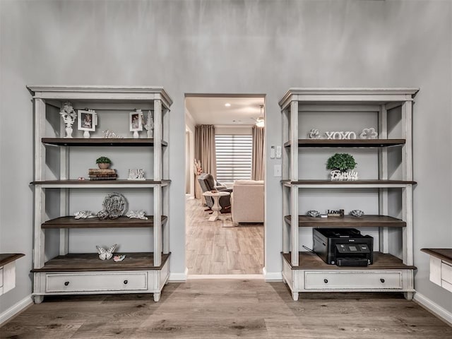 interior details with wood finished floors and baseboards