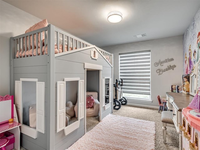 carpeted bedroom featuring visible vents