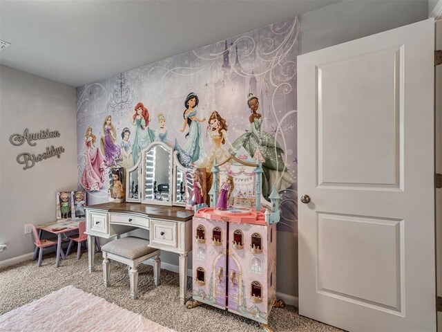 playroom featuring baseboards and carpet floors