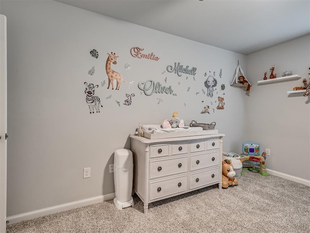 playroom featuring light colored carpet and baseboards