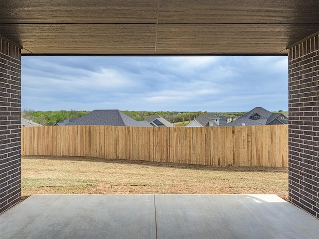 view of yard with a fenced backyard and a patio area