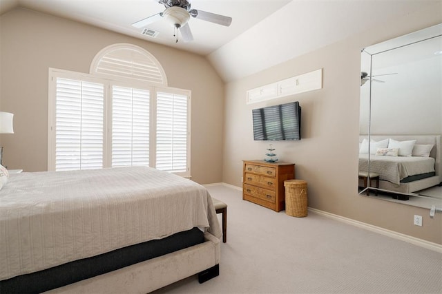 carpeted bedroom with baseboards, a ceiling fan, vaulted ceiling, and visible vents