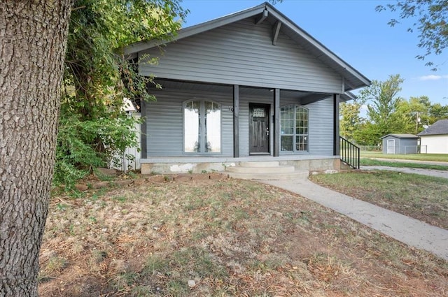 bungalow featuring a front yard and a porch