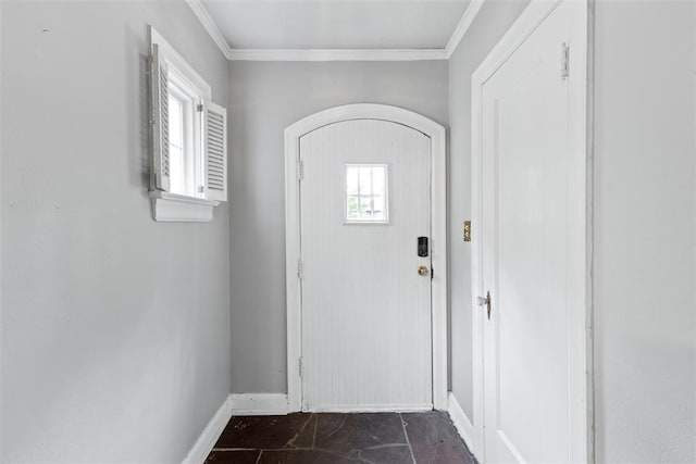 1201 E 18th St, Ada, OK 74820 - foyer with crown molding, arched walkways, and baseboards