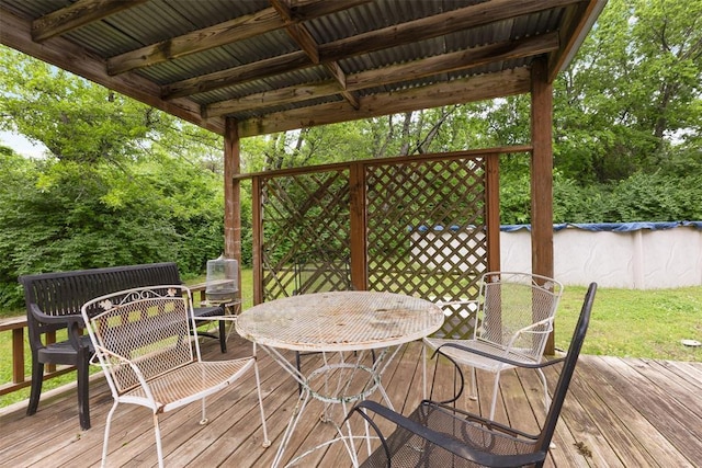 1201 E 18th St, Ada, OK 74820 - wooden terrace featuring outdoor dining area and an outdoor pool