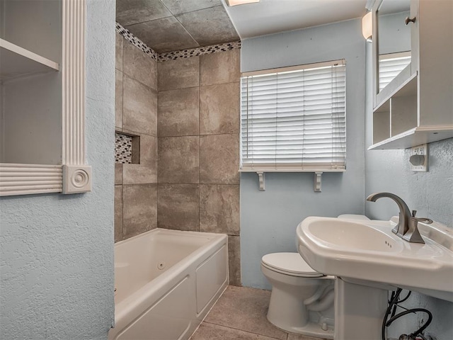 bathroom featuring toilet, tile patterned floors, and shower / bathing tub combination