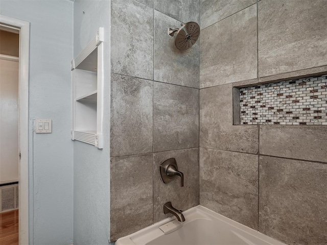 full bathroom with visible vents and washtub / shower combination