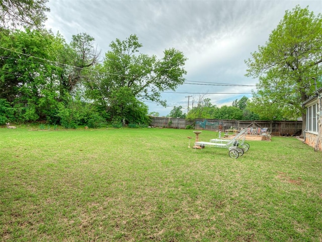 view of yard with a fenced backyard