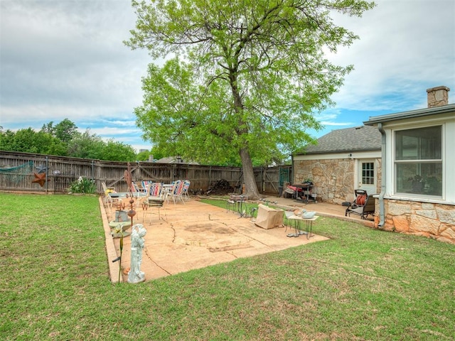 view of yard with a patio and a fenced backyard