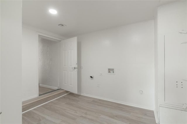 laundry area with hookup for a washing machine, gas dryer hookup, light wood finished floors, baseboards, and visible vents