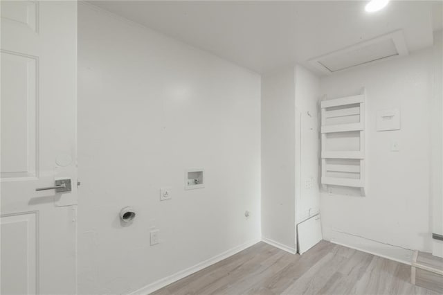 washroom with laundry area, light wood-type flooring, electric dryer hookup, hookup for a washing machine, and gas dryer hookup