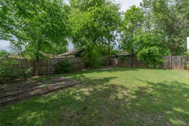 view of yard with a fenced backyard