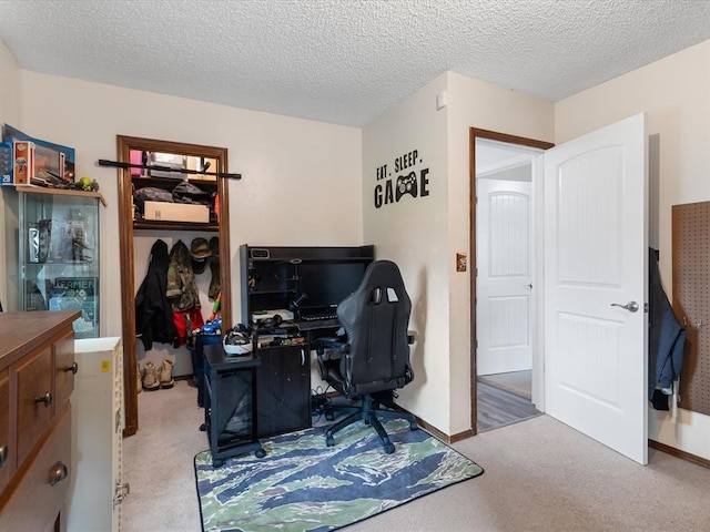 office featuring carpet flooring and a textured ceiling