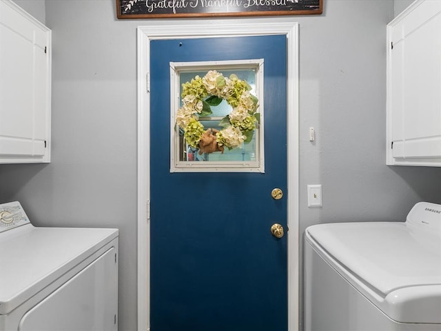laundry room with cabinet space and independent washer and dryer