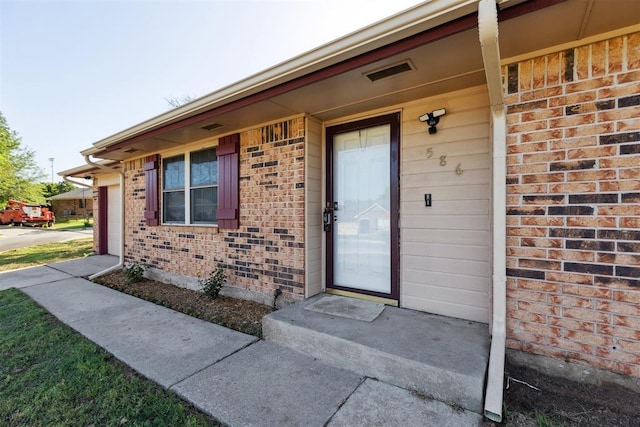 586 Seikel Dr, Choctaw, OK 73020 - doorway to property with brick siding