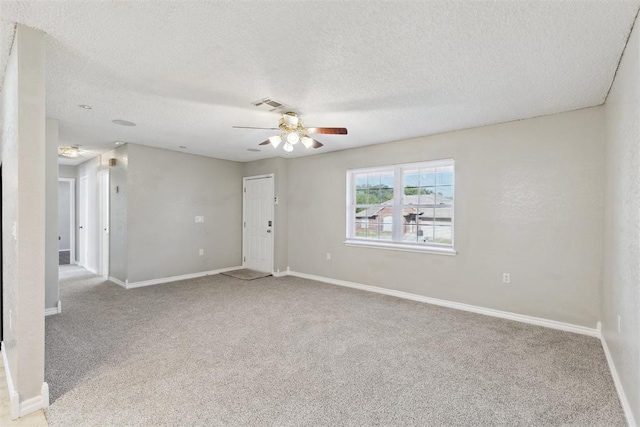 586 Seikel Dr, Choctaw, OK 73020 - empty room with light carpet, ceiling fan, a textured ceiling, and baseboards