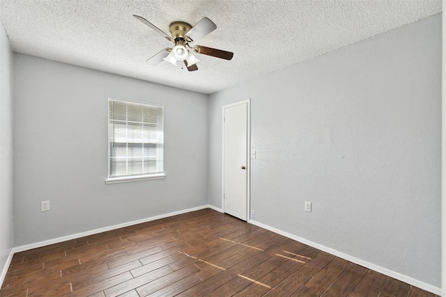 586 Seikel Dr, Choctaw, OK 73020 - spare room with ceiling fan, dark wood-style flooring, a textured ceiling, and baseboards
