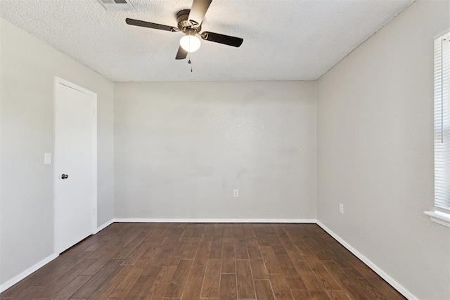 586 Seikel Dr, Choctaw, OK 73020 - unfurnished room featuring dark wood-style floors, a ceiling fan, a textured ceiling, and baseboards