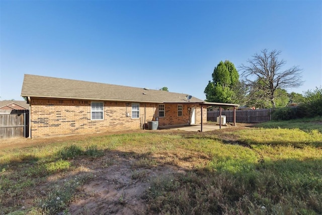 586 Seikel Dr, Choctaw, OK 73020 - rear view of property with a patio area, fence, and brick siding